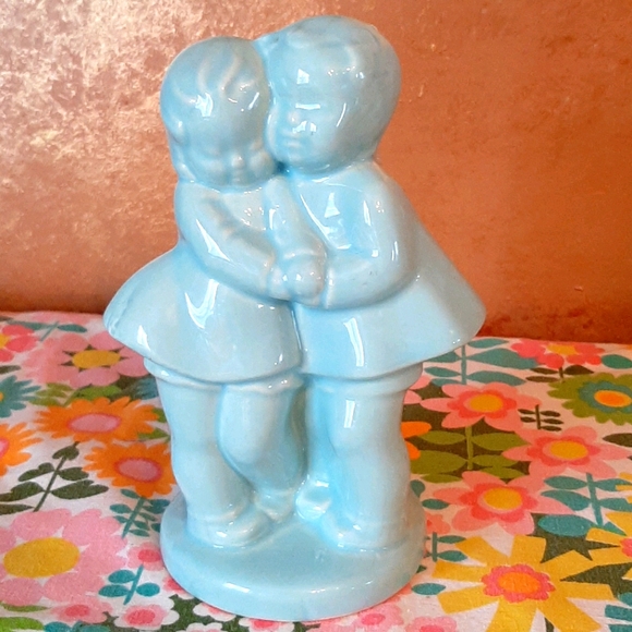Vintage pottery boy and girl planter blue